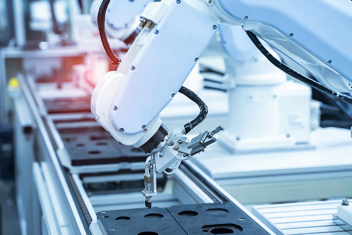 Robotic arm performing visual inspection on assembly line