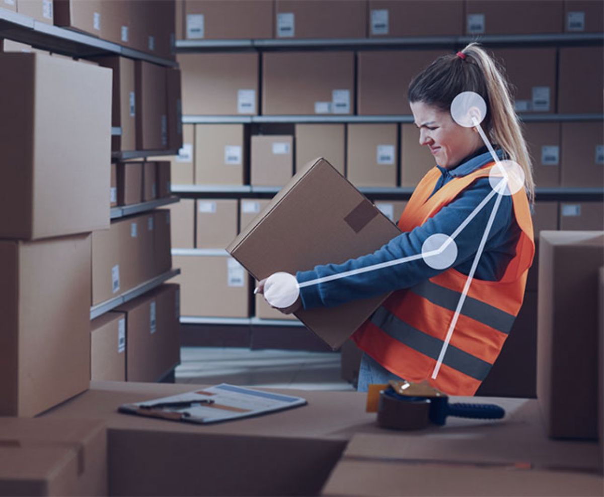 Worker lifting a box, captured for movement analysis