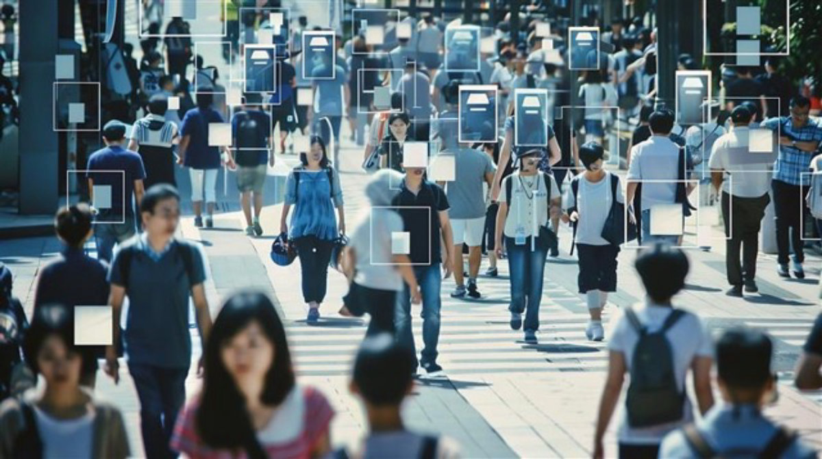 Blurred motion of people walking through a public area